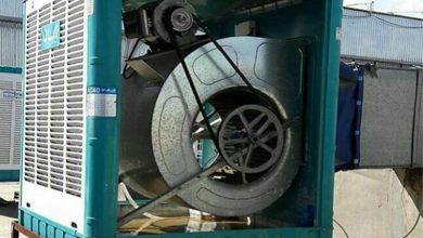 A large metal fan in a blue container AI-generated content may be incorrect.